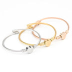 Aurelia™ Gold Heart Seal Bangle